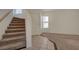 Welcoming entryway with tiled flooring and carpeted stairs at 8329 Telescope Peak Ct, Las Vegas, NV 89145