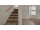 Welcoming entryway with carpeted stairs and tiled floor at 8329 Telescope Peak Ct, Las Vegas, NV 89145