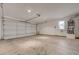 Bright and spacious garage with a water heater in the corner and ample room for parking or storage at 8329 Telescope Peak Ct, Las Vegas, NV 89145