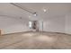 Spacious garage with concrete flooring and a water heater in the corner, ready for parking or storage at 8329 Telescope Peak Ct, Las Vegas, NV 89145
