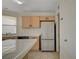 Kitchen features stainless steel refrigerator and tiled island at 8329 Telescope Peak Ct, Las Vegas, NV 89145