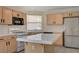Kitchen with center island and neutral cabinetry at 8329 Telescope Peak Ct, Las Vegas, NV 89145