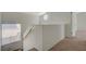 Bright upstairs landing with railing and a view of the neighborhood at 8329 Telescope Peak Ct, Las Vegas, NV 89145