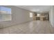 Open-concept living space with kitchen, and tile flooring throughout at 8329 Telescope Peak Ct, Las Vegas, NV 89145