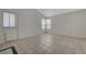 Living room has tile flooring, neutral walls, and a door to the outside at 8329 Telescope Peak Ct, Las Vegas, NV 89145