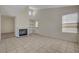Bright living room with fireplace and tile flooring at 8329 Telescope Peak Ct, Las Vegas, NV 89145