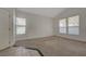 Living room features vaulted ceilings, carpet, and many windows at 8329 Telescope Peak Ct, Las Vegas, NV 89145