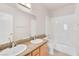 Neutral bathroom offers double sinks, updated fixtures, and a shower-tub combo at 8912 Galena Crossing St, Las Vegas, NV 89123