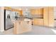 Bright kitchen features stainless steel appliances and a granite-topped island at 8912 Galena Crossing St, Las Vegas, NV 89123