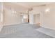 Living room with archways, carpet and access to other rooms at 8912 Galena Crossing St, Las Vegas, NV 89123