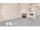 Spacious living room with a fireplace and soft grey carpet at 8912 Galena Crossing St, Las Vegas, NV 89123