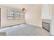 Living room features large windows, a cozy fireplace, and modern lighting at 8912 Galena Crossing St, Las Vegas, NV 89123
