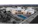 Aerial view showcasing a contemporary home, a large swimming pool, and expansive backyard at 9780 Solar Ave, Las Vegas, NV 89149