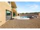 Modern backyard featuring a pool, gravel landscaping, and contemporary exterior design at 9780 Solar Ave, Las Vegas, NV 89149