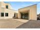 Contemporary home with a desert-landscaped backyard and inviting patio area at 9780 Solar Ave, Las Vegas, NV 89149