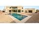 Aerial view of a modern backyard showcasing a large swimming pool and the contemporary home design at 9780 Solar Ave, Las Vegas, NV 89149