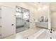 Modern bathroom showcases a glass shower with a bench, complemented by a floating vanity at 9780 Solar Ave, Las Vegas, NV 89149