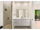 Contemporary bathroom boasting a glass shower and vanity with stone counters at 9780 Solar Ave, Las Vegas, NV 89149