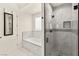 Modern bathroom featuring a glass-enclosed shower and luxurious soaking tub at 9780 Solar Ave, Las Vegas, NV 89149
