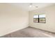 Bedroom featuring neutral carpet and a window at 9780 Solar Ave, Las Vegas, NV 89149