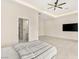 Spacious bedroom featuring a ceiling fan, tile flooring, and contemporary design at 9780 Solar Ave, Las Vegas, NV 89149