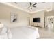 Bright bedroom featuring a ceiling fan, tile flooring, and modern design at 9780 Solar Ave, Las Vegas, NV 89149