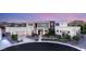 Beautiful home with a modern exterior, featuring a clean facade, balcony, and landscaped front yard at 9780 Solar Ave, Las Vegas, NV 89149