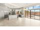 Sleek kitchen featuring a marble island, stainless steel appliances, and a large window at 9780 Solar Ave, Las Vegas, NV 89149