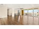 Bright living room boasts hardwood floors, modern ceiling fan, and large windows offering great views at 9780 Solar Ave, Las Vegas, NV 89149
