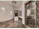 Bathroom with crystal chandelier and mosaic tile shower at 1 Quail Run Rd, Henderson, NV 89014