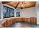 Sunlit breakfast nook with built-in cabinets and large windows overlooking backyard at 1 Quail Run Rd, Henderson, NV 89014