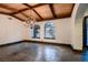 The dining room is bright with arched windows, a chandelier, and an open floor plan at 1 Quail Run Rd, Henderson, NV 89014
