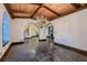 Open dining area features a wooden beam ceiling and arched doorways to other rooms at 1 Quail Run Rd, Henderson, NV 89014