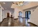 Grand foyer featuring tile floors, a high ceiling, and decorative arched doorways at 1 Quail Run Rd, Henderson, NV 89014