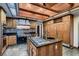 Kitchen with wooden cabinets, granite countertops, and stainless steel appliances at 1 Quail Run Rd, Henderson, NV 89014