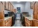 Well-lit laundry room with cabinets, countertops, and updated appliances at 1 Quail Run Rd, Henderson, NV 89014