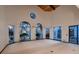 Spacious living room with high ceilings and arched windows offers plenty of natural light at 1 Quail Run Rd, Henderson, NV 89014