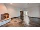 Spacious living room featuring stone floors and a fireplace at 1 Quail Run Rd, Henderson, NV 89014