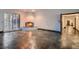 Open living room features stone flooring and a brick fireplace at 1 Quail Run Rd, Henderson, NV 89014
