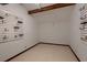 Versatile room featuring custom rack storage and neutral carpeting at 1 Quail Run Rd, Henderson, NV 89014