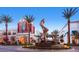 The District at Green Valley Ranch town square with palm trees, art installations, and shops at 1 Quail Run Rd, Henderson, NV 89014