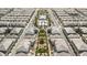 Aerial view of community homes showcasing symmetrical layouts, common green space, walkways, and a tranquil environment at 12126 Azure Gate Rd # 1, Las Vegas, NV 89183