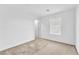Bright bedroom with beige carpet, white walls, and a window at 12126 Azure Gate Rd # 1, Las Vegas, NV 89183