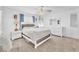 Bright bedroom featuring a fluffy white bed, ceiling fan, and white dresser at 12126 Azure Gate Rd # 1, Las Vegas, NV 89183
