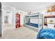 Bedroom with a gray bunk bed, adjacent study area, and a view of hallway at 12126 Azure Gate Rd # 1, Las Vegas, NV 89183