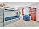 Cozy bedroom with gray bunk bed, beanbag chair, and colorful curtains at 12126 Azure Gate Rd # 1, Las Vegas, NV 89183