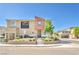 Charming townhouse featuring desert landscaping, covered balcony, and a stylish, modern facade at 12126 Azure Gate Rd # 1, Las Vegas, NV 89183