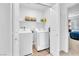 Laundry room with washer, dryer, and storage shelves at 12126 Azure Gate Rd # 1, Las Vegas, NV 89183