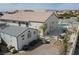 An eye-level view of the fenced-in backyard with a pool, outbuilding, and patio at 1252 N Sloan Ln, Las Vegas, NV 89110