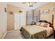Bedroom featuring a Queen size bed and ceiling fan with a double door closet at 1252 N Sloan Ln, Las Vegas, NV 89110